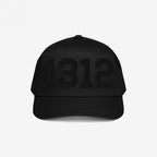 Black 1312 ACAB Hat featuring tonal block numerals 1312 on the front. This baseball-style cap, with a curved brim and stitched eyelets, symbolizes protest and police accountability.