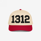 Two-tone 1312 ACAB Hat featuring a light beige front with bold black 1312 numerals, red bill, and top button. Designed for those advocating police accountability and resisting injustice.