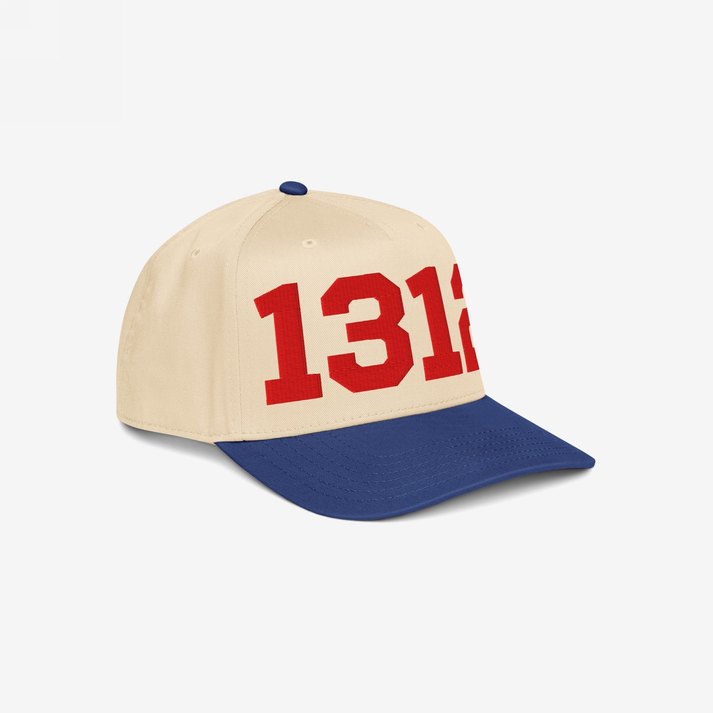 The 1312 ACAB Hat features an off-white crown with royal blue visor, prominently displaying 1312 in bold red numbers, reflecting a stance against police brutality and support for accountability.