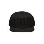 Black flat-brimmed snapback hat with 1312 in glossy black embroidery on the front, symbolizing ACAB. Ideal for advocating pol