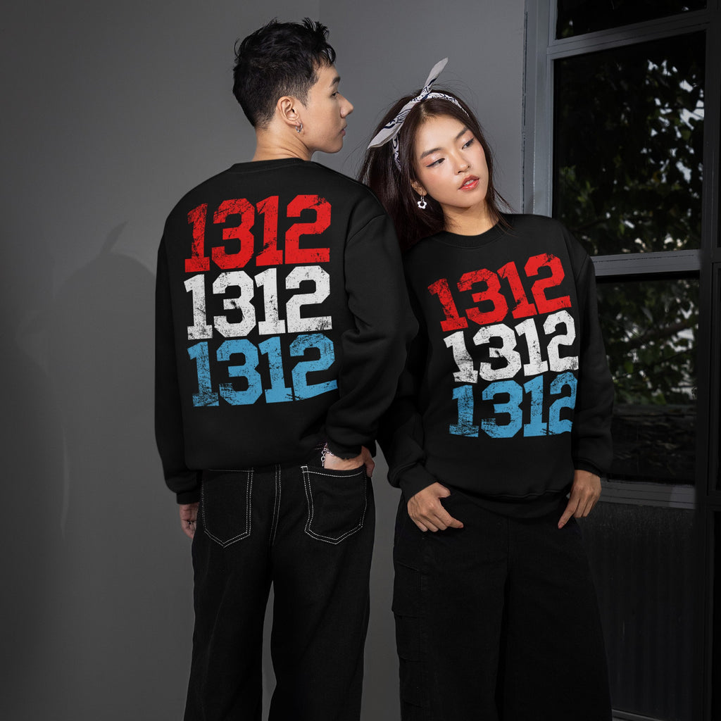 1312 ACAB Sweatshirt features stacked distressed numbers in red, white, blue. Female model shows front; male shows back. Represents anti-police brutality stance. Ideal for protests or everyday advocacy.