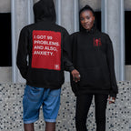 Two models in 99 Problems Hoodie; bold back graphic reads “I GOT 99 PROBLEMS. AND ALSO, ANXIETY.” Front features subtle “EGO PROOF” logo; embodying comfort and unapologetic honesty.