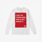 99 Problems T-shirt: White long-sleeve tee with bold red graphic, featuring humorous text on anxiety. Expressive design embodies authenticity and resilience for those embracing life's chaos.