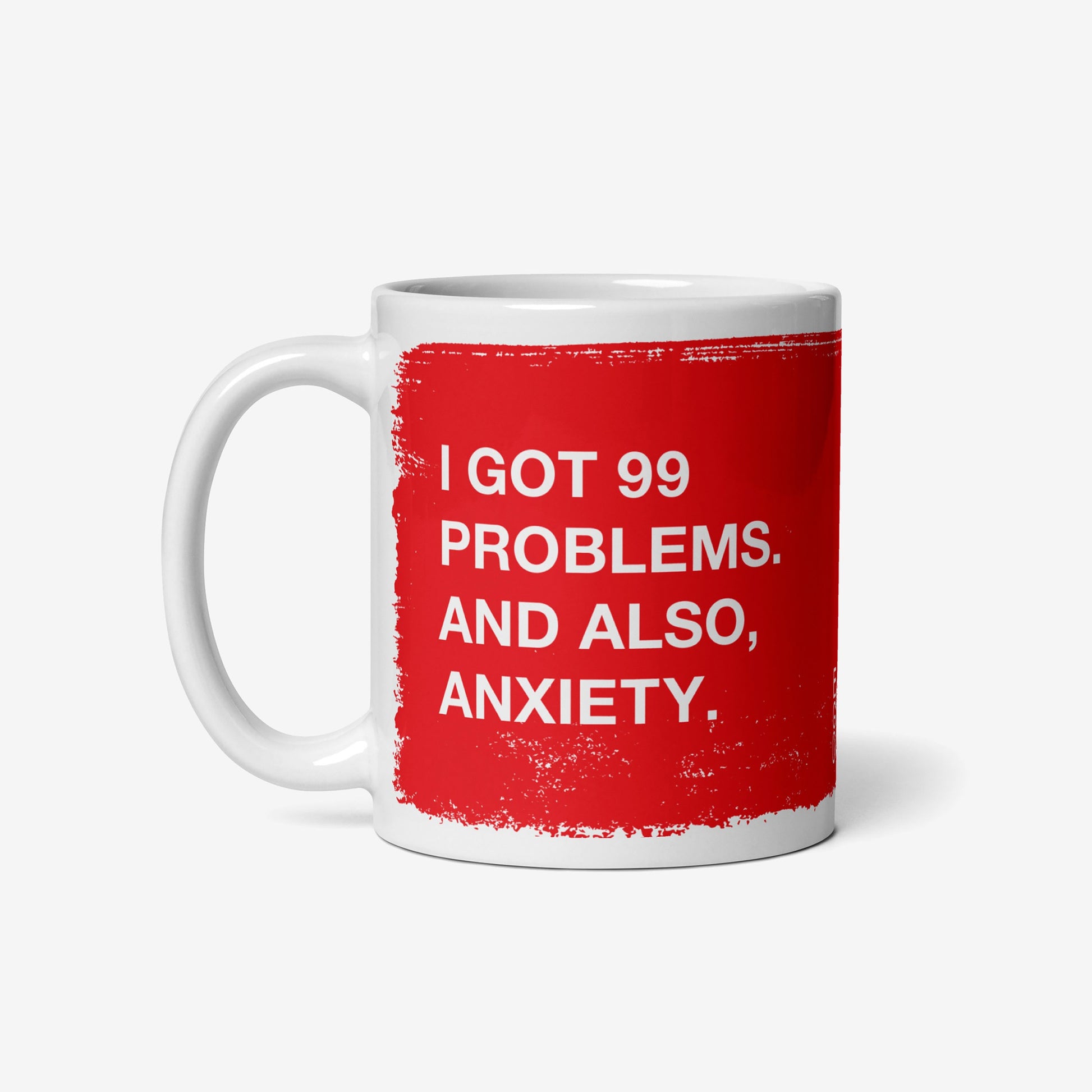 99 Problems Mug with bold red block and distressed white text humorously addressing anxiety. Perfect for mornings needing a sarcastic touch. Holds 11 oz, microwave and dishwasher safe.