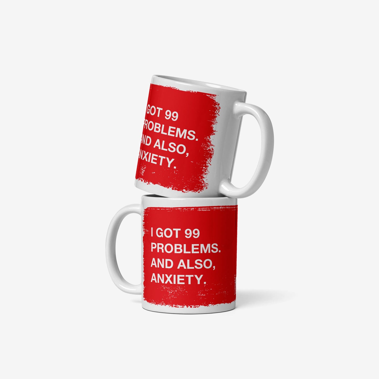 99 Problems Mug featuring bold white text on red, humorously highlighting anxiety. Two white ceramic mugs, stackable design, perfect for those who appreciate sarcasm and solidarity in everyday moments. Dishwasher, microwave safe.