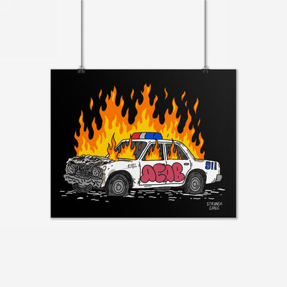 ACAB Police Car Poster depicting a flaming, wrecked white police sedan with red graffiti, ACAB, and 911 on the rear. Evokes defiance and punk attitude.