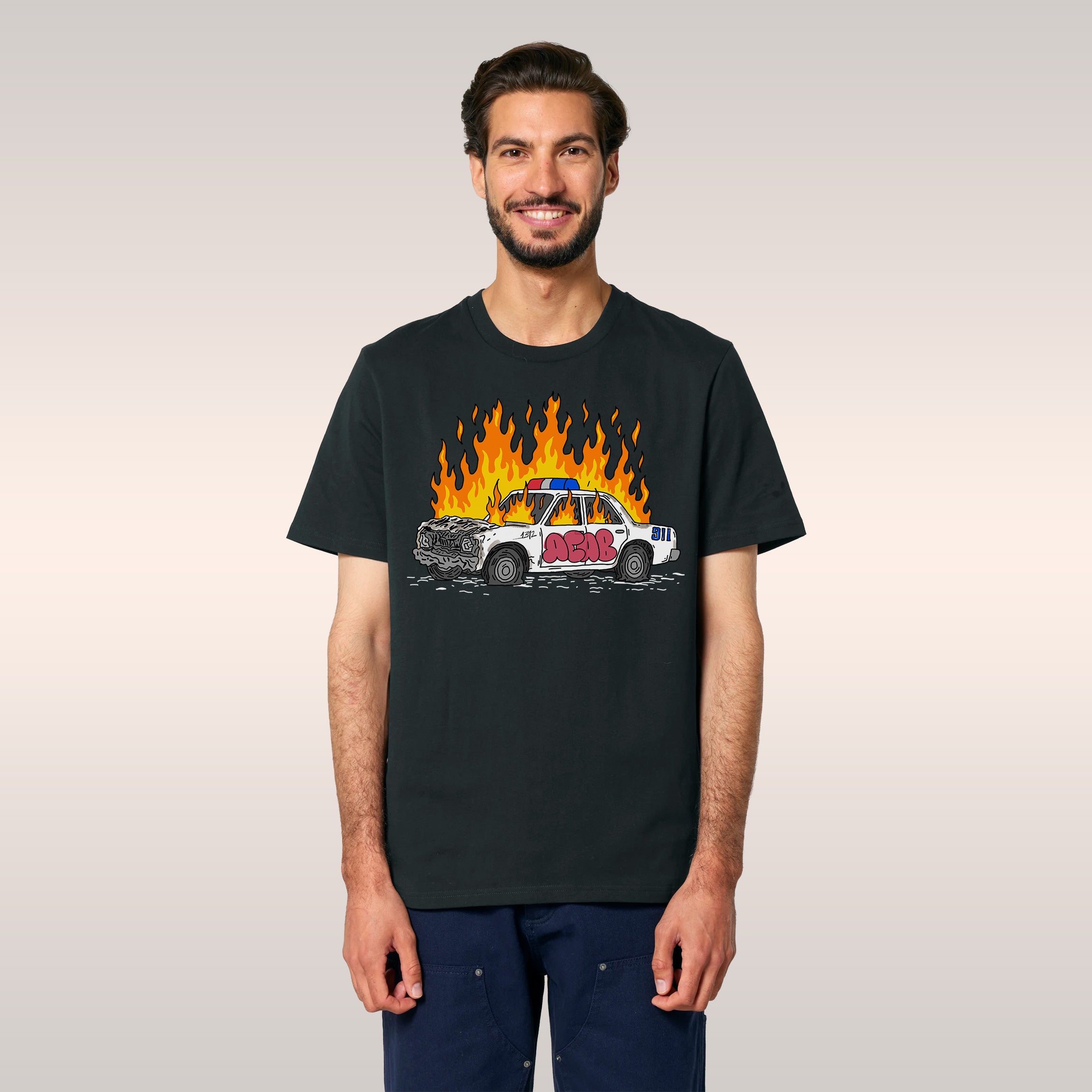 Man wearing ACAB Police Car Shirt with hand-drawn flaming police car and graffiti 1312 design in urban setting
