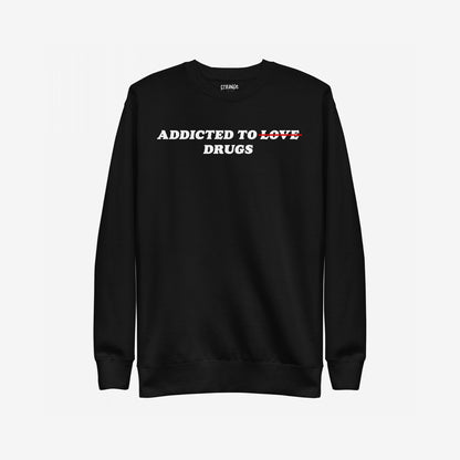 Addicted To Love / Drugs Hoodie & Sweatshirt features a bold statement design with ADDICTED TO LOVE and LOVE crossed out in red, replaced by DRUGS, reflecting personal struggle and self-awareness.