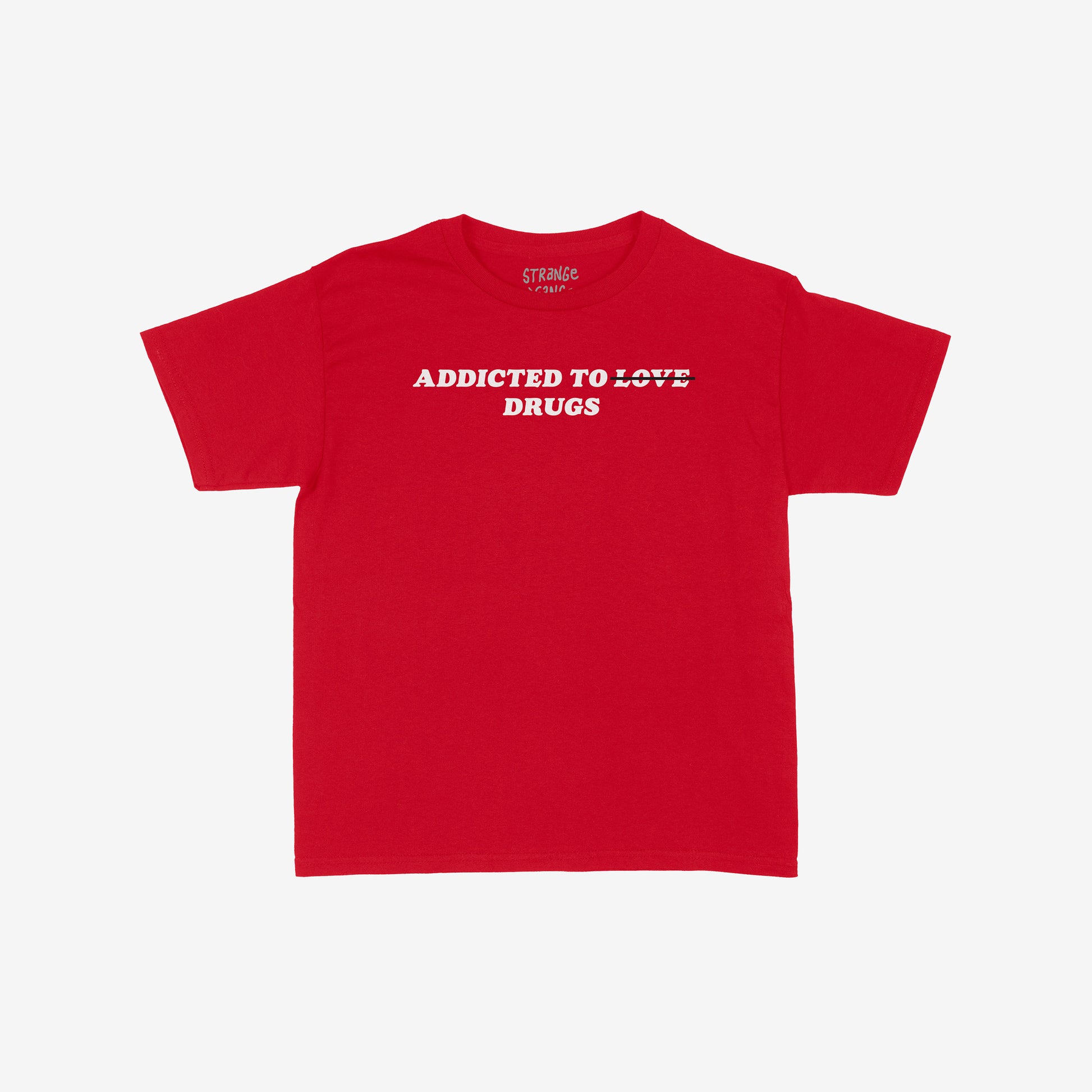 Addicted To Love / Drugs Women's Baby Tee featuring bold white text with LOVE struck-through and replaced by DRUGS, capturing chaotic humor and honesty on a plain red crew-neck style.