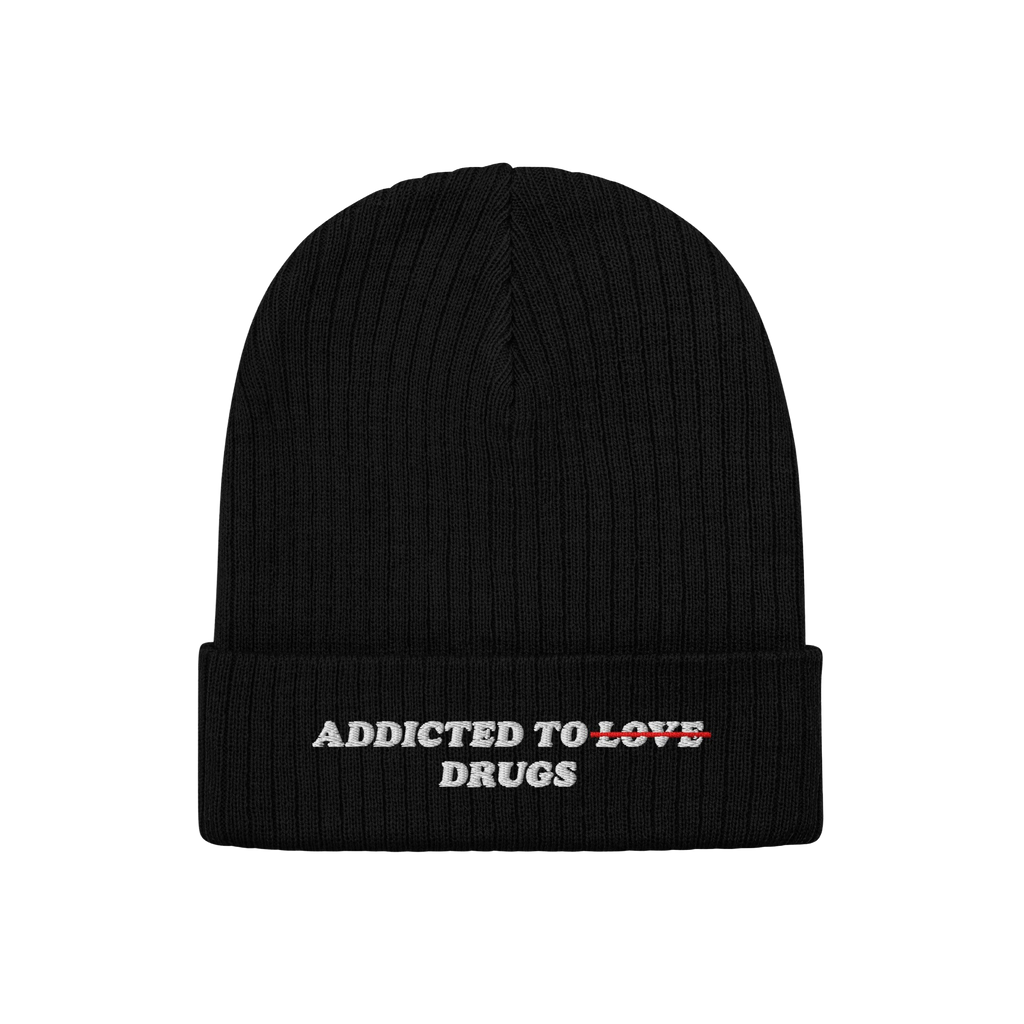 Black knit beanie featuring embroidered bold text "Addicted To Love" crossed out and replaced with "Drugs" from the Addicted 