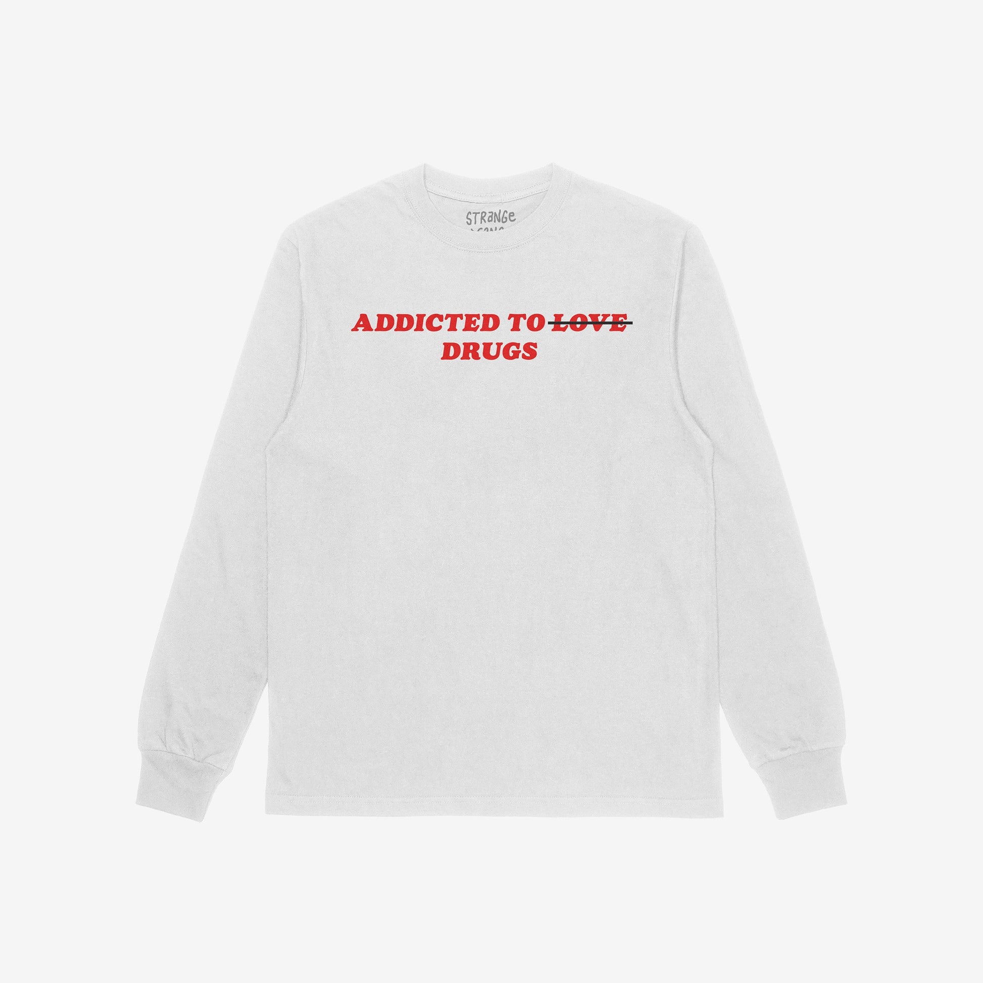 Light-gray long-sleeve T-shirt with bold red text: ADDICTED TO ~LOVE~ DRUGS. LOVE is crossed out. The Addicted To Love / Drugs T-shirt blends irony and edge, reflecting bold honesty.