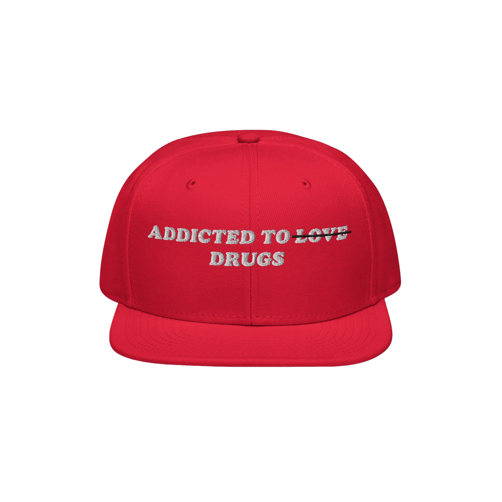 Red snapback hat with embroidered "Addicted To Love" crossed out and replaced by "Drugs" text, titled Addicted To Love / Drug