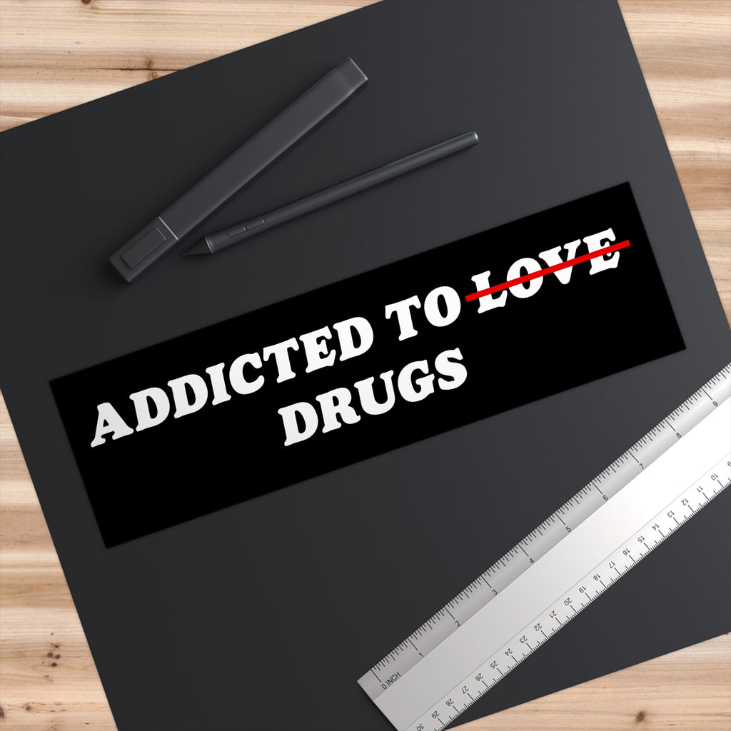 Addicted To Love / Drugs Sticker & Magnet with "Love" crossed out, white text on black vinyl background, durable and waterproof design.
