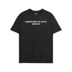 Addicted To Love / Drugs Shirt with bold text crossing out "Love" replaced by "Drugs" on a black t-shirt.