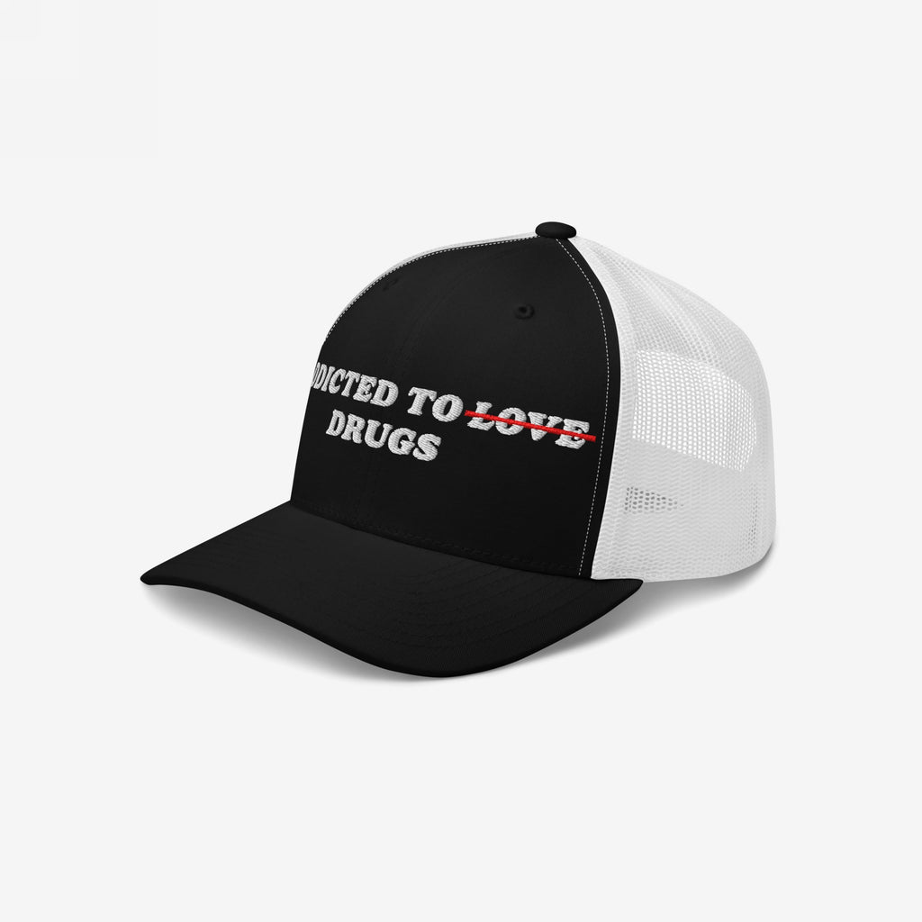 Black and white mesh snapback hat with embroidered text "Addicted To Love" crossed out and replaced by "Drugs" on front, Addicted To Love / Drugs Hat.