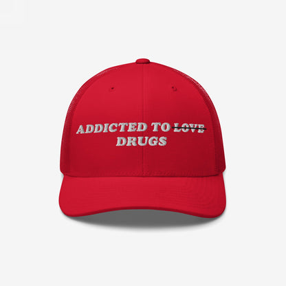 Red snapback hat with embroidered text "Addicted To Love" crossed out and replaced by "Drugs" - Addicted To Love / Drugs Hat.