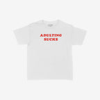 Adulting Sucks Women's Baby Tee features bold red ADULTING SUCKS text on a white short-sleeve shirt, perfectly embodying sarcasm and a vintage vibe for those navigating adulthood's challenges.