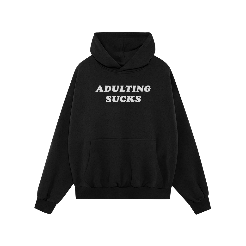 Black pullover hoodie with drawstring hood and kangaroo pocket, featuring ADULTING SUCKS in bold white letters on the chest. 