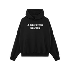 Black pullover hoodie with drawstring hood and kangaroo pocket, featuring ADULTING SUCKS in bold white letters on the chest. 