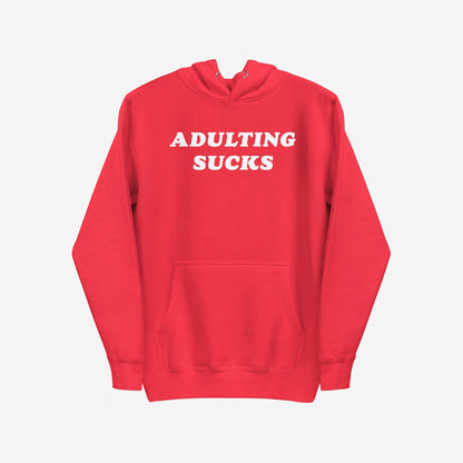 Adulting Sucks Hoodie & Sweatshirt features bold white text stating “ADULTING SUCKS.” on a cozy, retro-style fleece, combining humor with comfort for those navigating life's challenges.