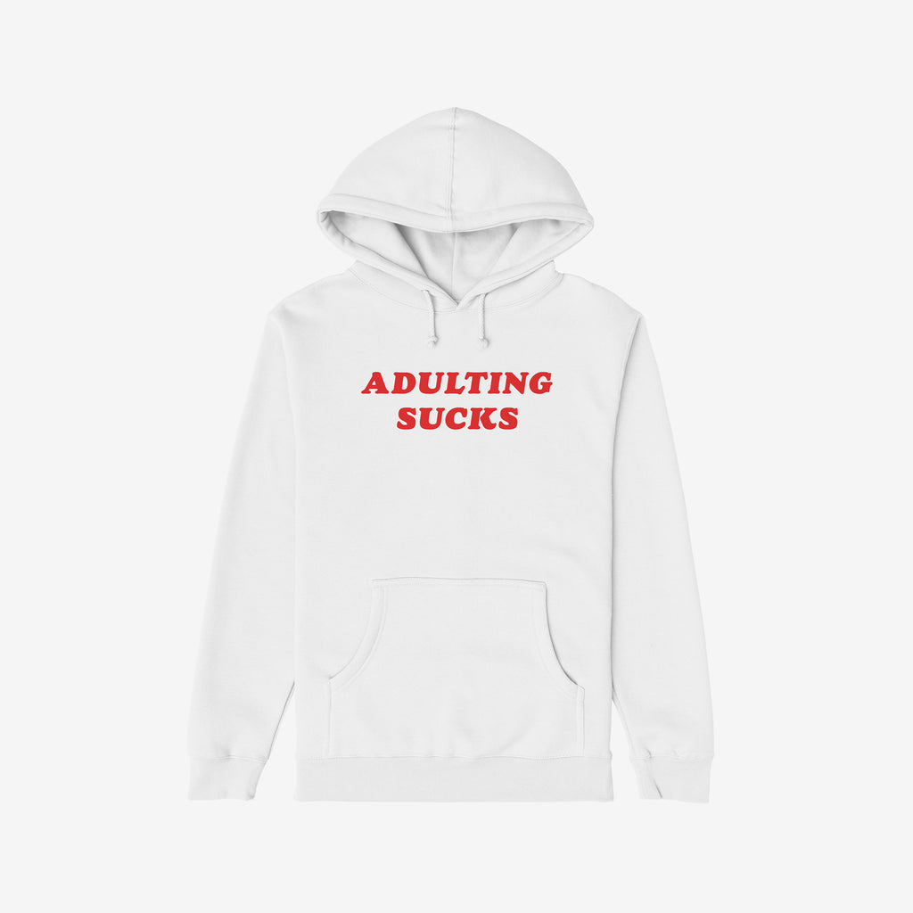 White hoodie featuring bold red ADULTING SUCKS print, perfect for expressing humor and relatable sentiments. Ideal for casual comfort and self-expression, supporting NAMI. Available in various styles.