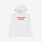 White hoodie featuring bold red ADULTING SUCKS print, perfect for expressing humor and relatable sentiments. Ideal for casual comfort and self-expression, supporting NAMI. Available in various styles.