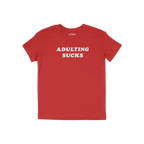 Adulting Sucks Shirt featuring bold white text on a plain red short-sleeve crew-neck, capturing a humorous take on adult life