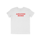 White T-shirt with bold red lettering ADULTING SUCKS, embodying humor and vintage flair, perfect for expressing the challenge