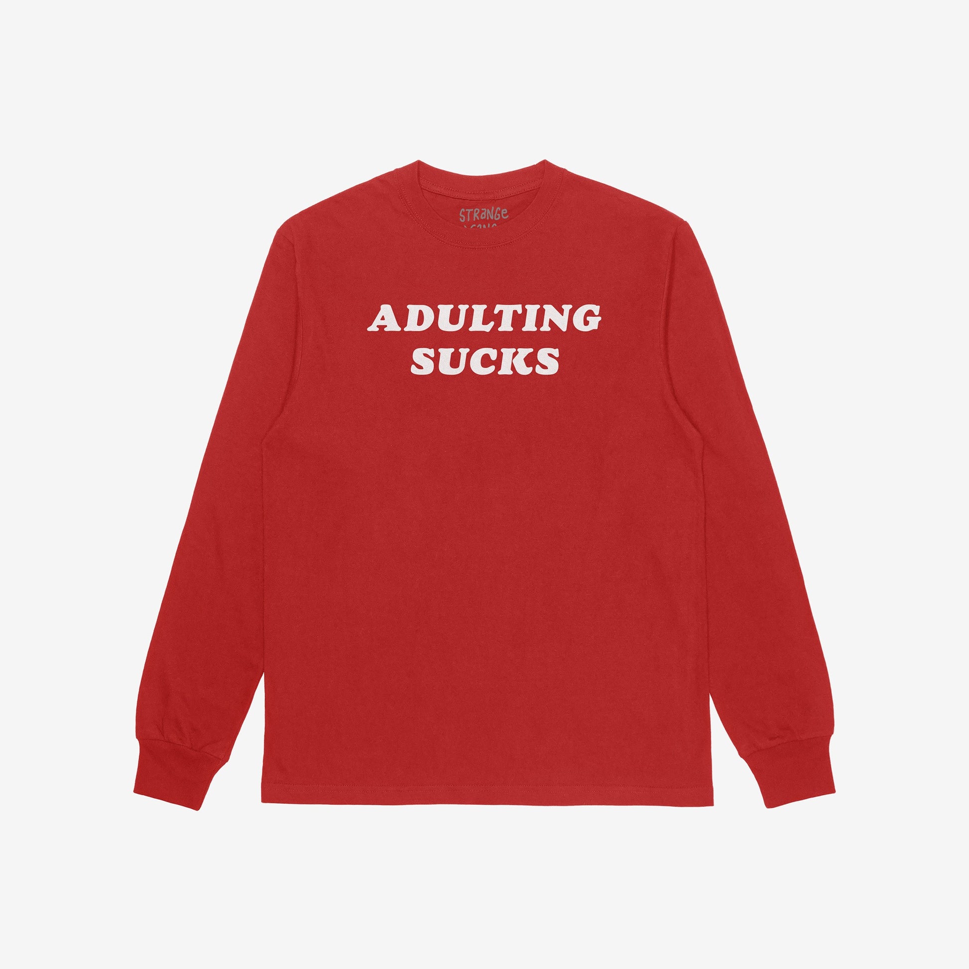 Red long-sleeve T-shirt with ADULTING SUCKS in bold white letters across the chest, featuring a retro typeface. Part of a collection supporting equality and self-expression.