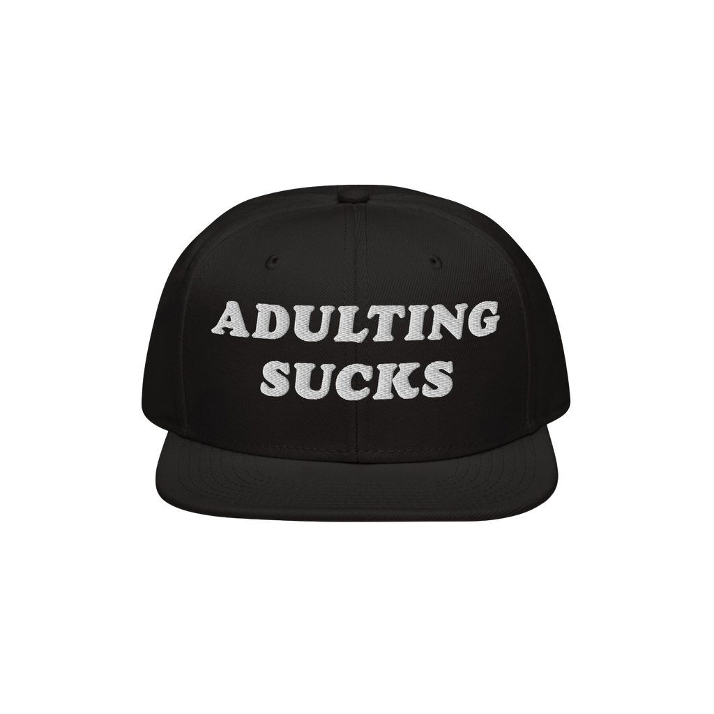 Black snapback hat with white, bold embroidered text ADULTING SUCKS on the front. Perfect for expressing frustration with adu