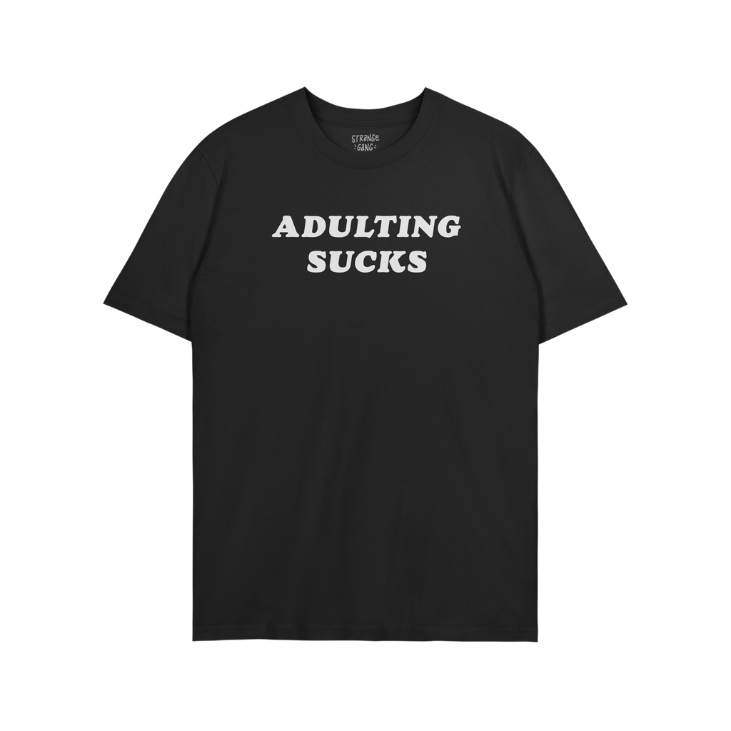Black T-shirt featuring the slogan “ADULTING SUCKS” in white block letters, embodying humor and relatable self-expression
