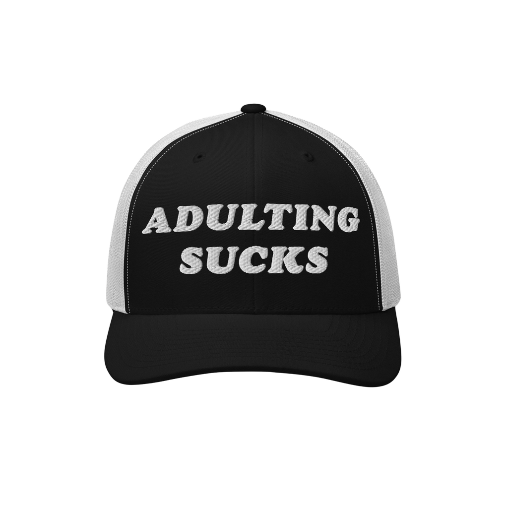 Black-and-white trucker hat with ADULTING SUCKS embroidered on front. Features white mesh panels, curved black bill. Ideal fo