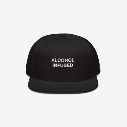 The Alcohol Infused Hat is a black snapback with bold white embroidery, combining humor and edge, perfectly reflecting a fearless, statement-making style.