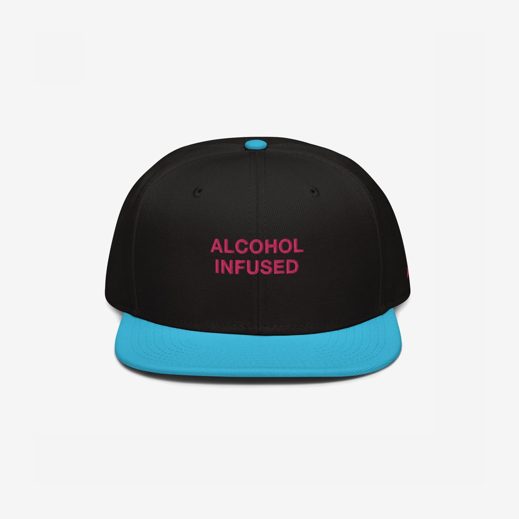 Alcohol Infused Hat: A bold snapback with 'ALCOHOL INFUSED' in magenta on a black crown, featuring a turquoise flat brim, reflecting a playful, rebellious spirit.