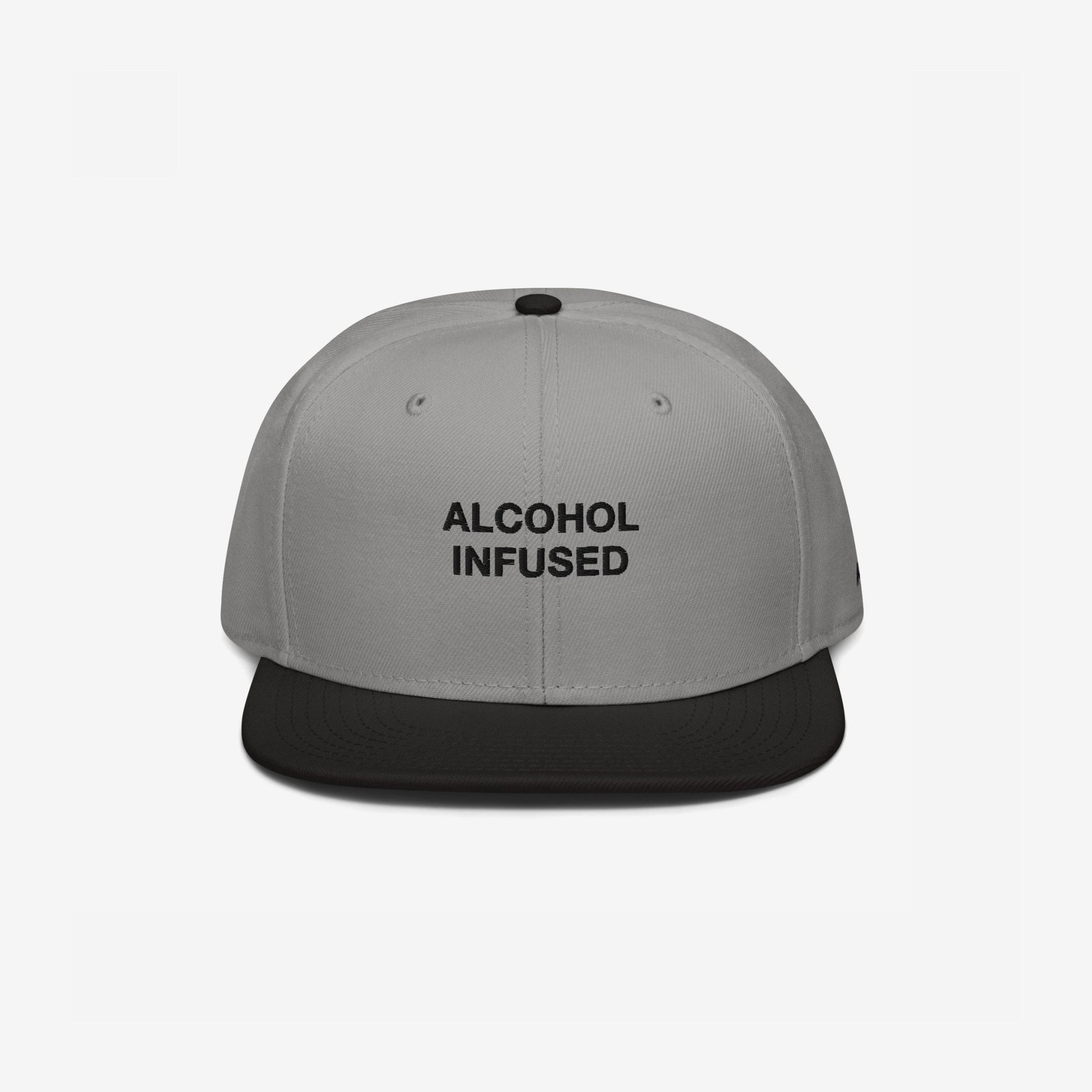 The Alcohol Infused Hat features a light gray crown with bold black embroidered text on a black flat brim, perfect for making a bold statement at any social gathering.
