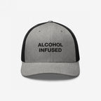 Alcohol Infused Hat: Gray-and-black trucker cap with 'ALCOHOL INFUSED' on front, blending humor with bold style, perfect for expressing individuality at social gatherings or casual outings.