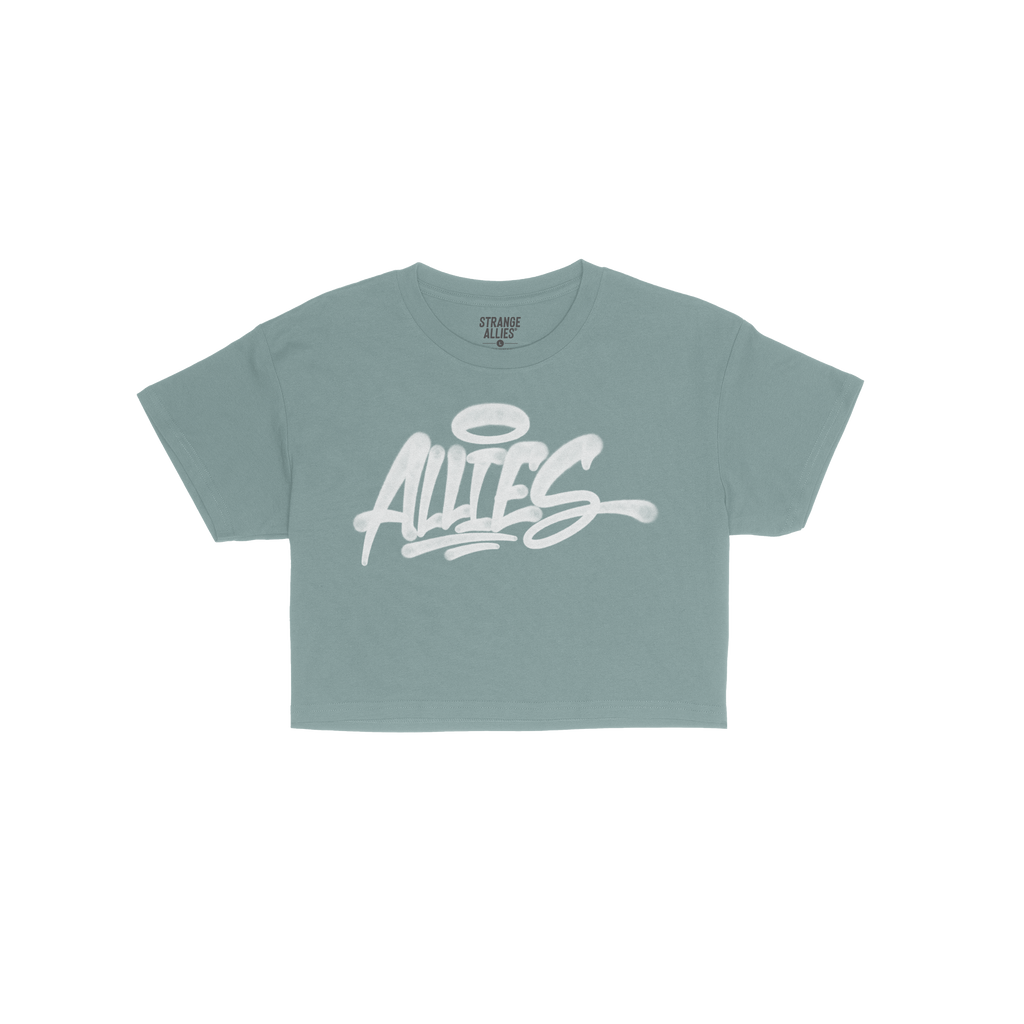 Allies Handstyle Women's Baby Tee with graffiti-style “ALLIES” script and halo motif, embodying loyalty and community. Sh