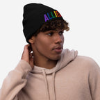 Young man wearing the Allies Rainbow Hat, a black knit beanie with ALLIES embroidered in rainbow colors, showcasing support for LGBTQ+ rights.