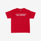 Anti-Fascism Is Self-Defense Women's Baby Tee with bold white text on red cotton. Retro-inspired design promotes standing up for beliefs. Brand name subtly visible at the back.