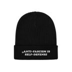 Black rib-knit beanie with ANTI-FASCISM IS SELF-DEFENSE embroidered on the cuff, embodying the Anti Fascism Is Self Defense H