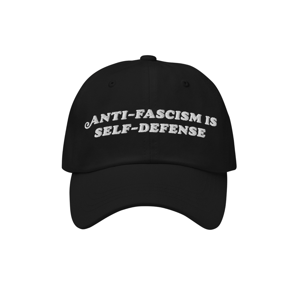 Black baseball-style cap with white embroidered text, “ANTI-FASCISM IS SELF-DEFENSE.” The Anti Fascism Is Self Defense Ha