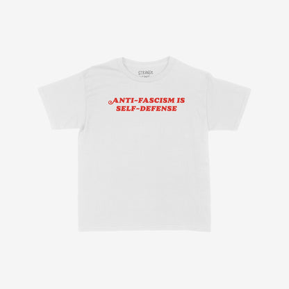 Anti-Fascism Is Self-Defense T-shirt with bold red vintage lettering across the chest, conveying a powerful message of resistance and equality. Available in various fits and sizes for all.