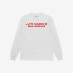 White long-sleeve T-shirt featuring bold red ANTI-FASCISM IS SELF-DEFENSE text, embodying a statement for justice and resistance. Ideal for those advocating against silence and supporting human rights.