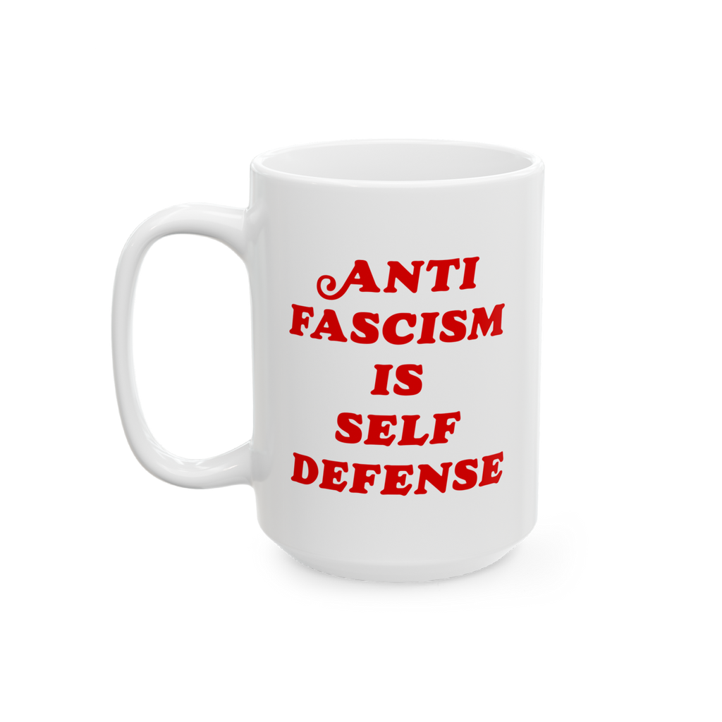 White ceramic Anti-Fascism Is Self-Defense mug with bold red text, featuring a standard C-handle and shiny finish, embodying 