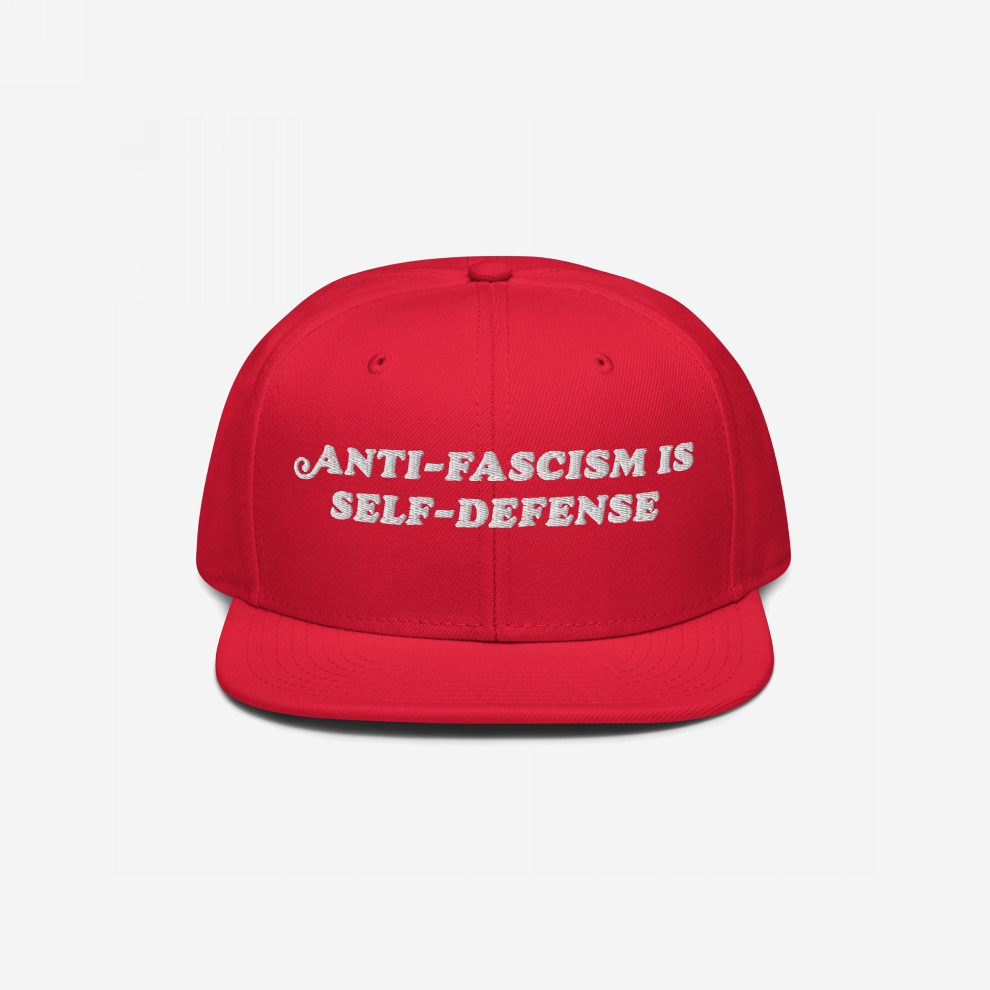 Anti-Fascism Is Self-Defense Hat: A red, flat-brim cap featuring bold white embroidery promoting anti-fascism, embodying resistance and activism. Perfect for those who champion equality and stand against oppression.