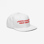 Anti Fascism Is Self Defense Hat features a bold slogan in red embroidery on a white baseball cap with a flat brim, embodying activist spirit and commitment to human rights.