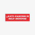 Anti-Fascism Is Self-Defense Sticker & Magnet featuring a crowded protest scene with a bold red banner. Available as a durable, all-weather sticker or magnet, perfect for expressing bold, clear stances.
