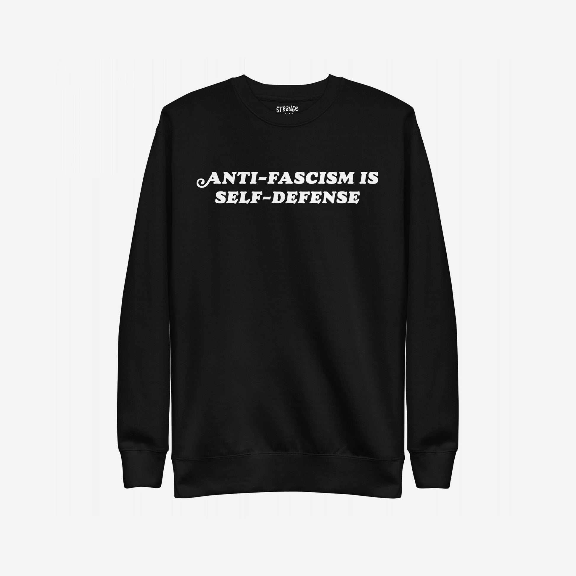 Anti-Fascism Is Self-Defense Hoodie & Sweatshirt features bold white lettering on a black crewneck, embodying a strong, anti-fascist message. Ideal for advocates of equality and resistance.