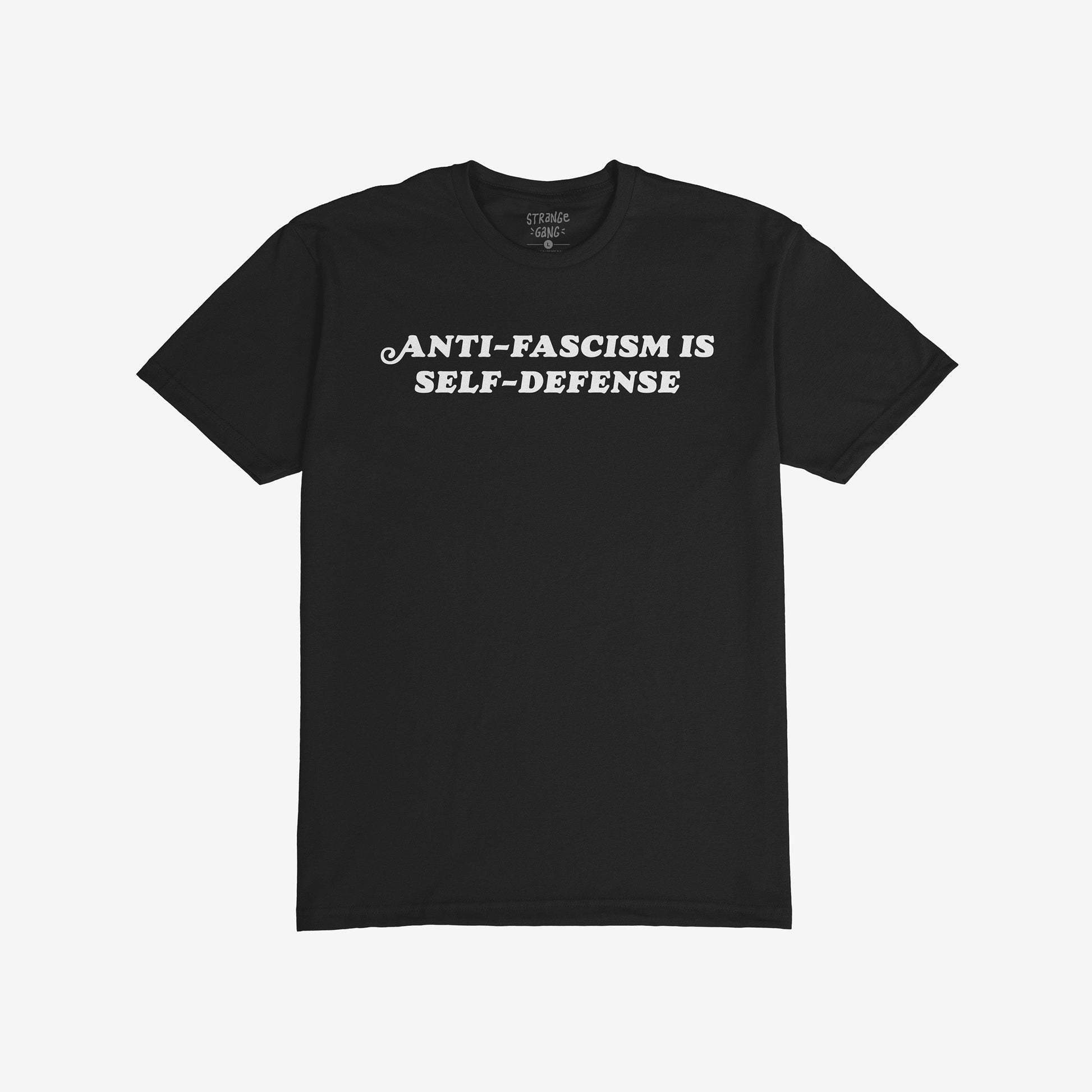 Anti-Fascism Is Self-Defense T-shirt featuring bold, white uppercase text on a plain black crew-neck, embodying a message of resistance and activism. Available in men’s/unisex and kids’ sizes, ships from the EU.