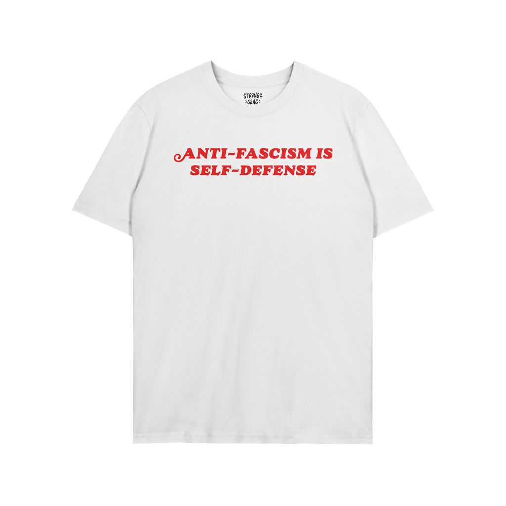 Anti Fascism Is Self Defense Shirt with bold red lettering on a plain white T-shirt, featuring a small inside collar label, e